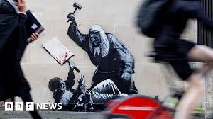 Banksy Frappe Fort: Juge Attaque Manifestant! Londres Choquée!
