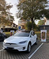 tesla at the supercharger tesla supercharger new tesla