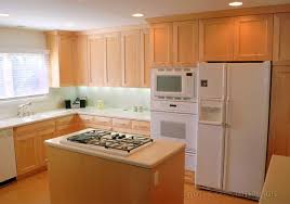 maple cabinets with white countertops