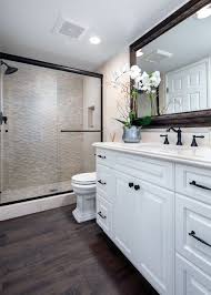These tiles instantly add modernity and timelessness at the same time. 15 Bathrooms With Amazing Tile Flooring Pebble Tile Shower Wood Floor Bathroom Wood Tile Bathroom Floor