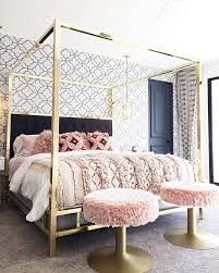 The gold metal sides of the canopy bed frame offer stability, while a center gold metal rail adds additional support, giving your little one a safe and beautiful place to rest her royal head at night. This Gold Brass Modern Canopy Bed Is Pure Glamour Home Decor Bedroom Modern Canopy Bed Canopy Bedroom