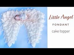 Rolled a long sausage length of the wings, dipped into cup of water, and placed. How To Make A Fondant Baby On Angel Wings Youtube