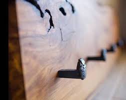Wooden coat hooks that are solid and sturdy for every day use, yet pretty enough for the front entrance? Coat Hooks Etsy