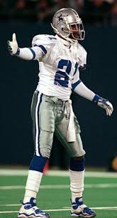 Deion sanders competing for the dallas cowboys in a game. Deion Sanders Dallas Cowboys Cowboys Football Helmets