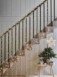 But i cannot figure out a good thing to do with them in my new apartment that does not make it look like a college dorm room. Curtain Lights 500 Bulbs Home Accessories Sale The White Company Christmas Stairs Decorations Christmas Decorations Apartment Christmas Staircase Decor