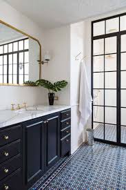 Stacked drawers line the middle of this cabinet, serving as great areas to place shared accessories. 25 Incredibly Stylish Black And White Bathroom Ideas To Inspire