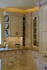 Stunning Cream Cabinets Paired With Granite Countertops Prove To Be An Excellent Design Choice In This Su Yellow Kitchen Glazed Kitchen Cabinets Kitchen Design