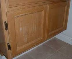 Water spotting and water rings on table tops due to spills, plants, and cups. Cabinet Care Maintenance Wellborn Cabinet