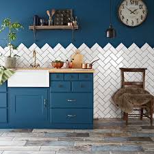 Dark Blue Country Kitchen Cabinets In Room With Greyish Brown Laminate Floor Blue Wall Half In 2020 Herringbone Tiles Kitchen Trendy Kitchen Tile Kitchen Tiles Design