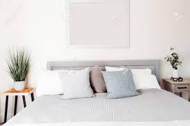 See more ideas about nightstand, bedroom night stands, drawer nightstand. Clean Bright And Airy Bedroom With Grey Bed Light Blue Cream Stock Photo Picture And Royalty Free Image Image 139157729