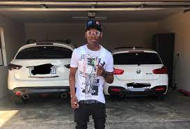 Thembinkosi lorch posed for a picture in front of his car (photo: Lorch Vs Billiat Who Had The Hottest Million Rand Car Upgrade