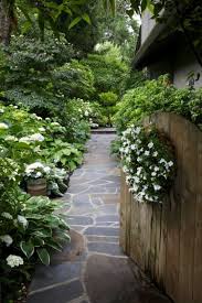 A White Garden Makes An Inviting Entrance To Sandy Woodley S One Third Acre Beautiful Gardens Shade Garden Outdoor Gardens