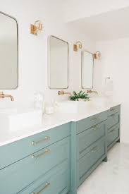 13 Envy Inducing Green Cabinets That Will Make Your Houseguests Jealous Hunker Green Bathroom Mint Green Bathrooms Bathroom Design Bathroom design green decor mint olive ideas.