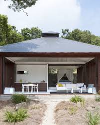 Water bungalows on a tropical island at evening. Tropical Beach House Renato D Ettorre Architects Archello