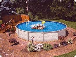 With a few natural and practical decorations, like plants or a pool chairs. Basic Above Ground Pool Landscaping Intheswim Pool Blog