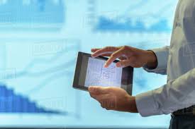Man Using Business Digital Tablet During Presentation With Graphs And D943_247_841