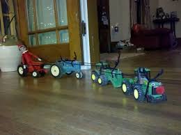 Outdoor christmas decorations using trees and foliage. John Deere Christmas