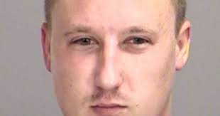 Husband charged after pointing gun at wife, shooting into wall