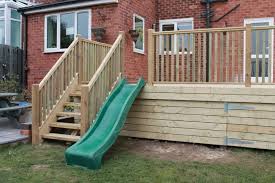 Raised Decking With Childrens Slide Play Area Completed In Diy Deck Deck Railing Design Playground Design