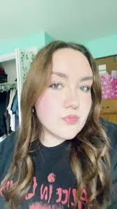 Women Singer Wearing Chain Mesh Top at Concert