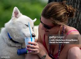 Regina Sayers of Revere, MA feeds Nico a slushie