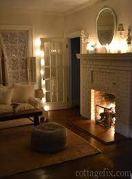 Cottage Fix Blog Living Room With White Candles Twinkle Lights And A Cozy Cottage Living Rooms Cozy Living Rooms Cozy Apartment Decor