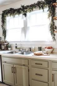 This is a really simple little trick, but a handy one to know about at this time of year! Christmas Kitchen Window Garland The Little By Little Home