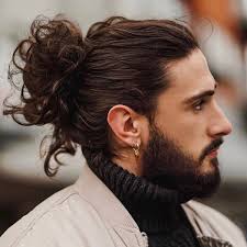 A bun is a type of hairstyle in which the hair is pulled back from the face, twisted or plaited, and wrapped in a circular coil around itself, typically on top or back of the head or just above the neck. 7 Types Of Man Bun Hairstyles Gallery How To