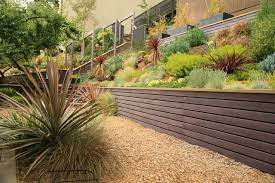 Having to shape a sloped area can be difficult without the use of a retaining wall. 10 Contemporary Retaining Walls Offer Fresh Ideas For Slopes