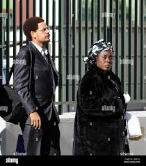 Nelson Lumumba Lee, left, grandson of Miriam Makeba, the South African  singer known to fans worldwide as Mama Africa, arrives at the Pineta Grande  clininc in Castel Volturno, southern Italy, where Miriam