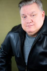 Chris (he/him) We love to see the difference from goofy dad vibes to  hardened criminal.