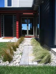 Coastal Garden Landscaping Rocks And Native New Zealand Grasses Coastal Landscaping Coastal Gardens Garden Landscape Design