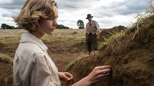 As wwii looms, a wealthy widow hires an amateur archaeologist to excavate the burial mounds on her estate. Netflix S The Dig Sets January 2021 Release Date What S On Netflix