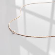 Discover the different types of choers and how to style and wear a choker. Mina Necklace Thatch