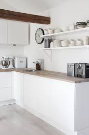 As part of your weekly cleaning routine, wipe cabinet exteriors with a soft, damp cloth or a damp microfiber cloth. Elisabeth Heathland Dream Kitchen Clean White Cupboards Wooden Benchtops And Whitewashed Floors Cocinas Blancas Decoracion De Cocina Cocinas