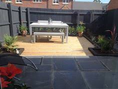 My Urban Garden Grey Fence Decking Black Sleepers Grey Fence Grey Slabs And Black Decking Fence Garden Grey Slabs Urban Garden Grey Fences Patio