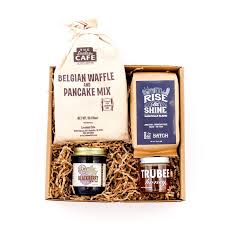 The care package gift includes a stainless steel french press that doubles as a travel tumbler, a bag of medium roast whole bean coffee and a nutritious nut butter bar snack. Work From Home Care Packages Batch
