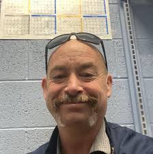 Recommebded fence builder to stop a dog from jumping out a chain length  fence.