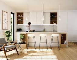 White kitchen with wooden island. Inspirations Essential Home Mid Century Furniture