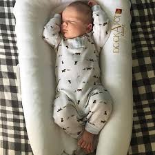Babies Sleep Soundly In Their Dockatot Baby Lounger Dockatot Is The Best Co Sleeper Portable Baby Bed And Infant Lou Baby New Baby Products Baby Boy Newborn