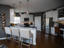 We are building and have kitchen cabinets and great room built ins in amazing gray and a kitchen island in urbane bronze. Gauntlet Gray Favorite Paint Colors Grey Painted Kitchen Sherwin Williams Paint Gray Grey Paint Colors