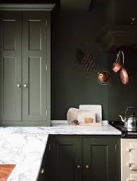 Bored Of White Kitchens Discover The Cabinet Color Trending Now Dark Green Kitchen Kitchen Wall Colors Green Kitchen Walls