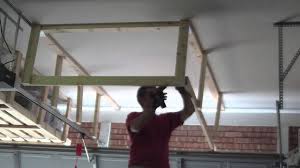 Everyone seems to build these out of plywood, but to me a 2×2 frame seemed way easier, especially given the strange curvatures (vertically and horizontally) of the walls here. Garage Overhead Storage Timelapse Youtube