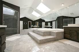 The white ceiling tiles reflect sunlight around the bathroom, making it appear larger. Modern Bathroom Design Features A Large Space And A High Ceiling With Skylight Interior Design Inspirations