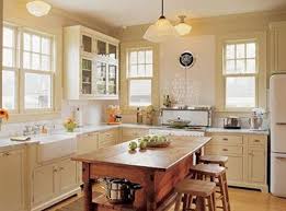 A Light For My Kitchen Sink Beneath My Heart White Kitchen Appliances Bungalow Kitchen Cream And White Kitchen