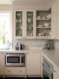 It's easy to add floating shelves to an existing kitchen with upper cabinets. Pin By Whitechocfrostn On Room By Room Inspiration Photos Cream Kitchen Cabinets Corner Kitchen Cabinet Kitchen Cabinet Design
