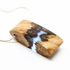The Mystery Of The Deep Blue Ocean Sharp Edges Under A Sea Of Resin In This Elegant Pendant Smooth Fin Resin Jewelry Tutorial Wood Resin Jewelry Wood Resin