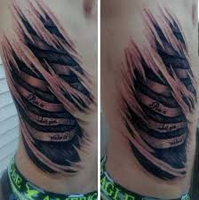Rib cage tattoos are popular among men as well, and they go for more complex and large designs, such as lion tattoo designs, tribal tattoo designs, quote tattoos, 3d tattoos, etc. Mens Rib Cage Bones Ripped Skin Tattoos Ripped Skin Tattoo Flesh Tattoo Ribcage Tattoo