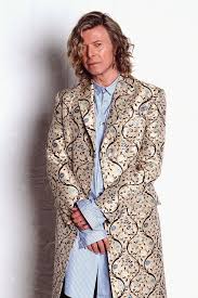 David bowie floral pattern dress in color. David Bowie S Most Memorable Fashion Moments David Bowie Looks
