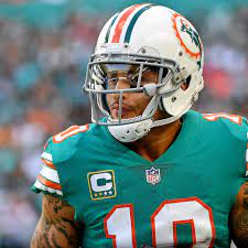 The nfl miami dolphins (custom serif) font is used for jersey lettering, player names, numbers, team logo, branding, and merchandise. Dolphins Wide Receiver Kenny Stills Wants To Make The Throwbacks Miami S Full Time Uniform The Phinsider